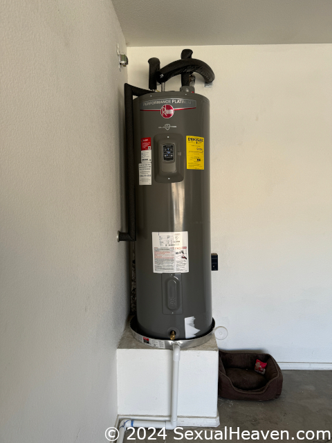 A water heater on a pedestal.